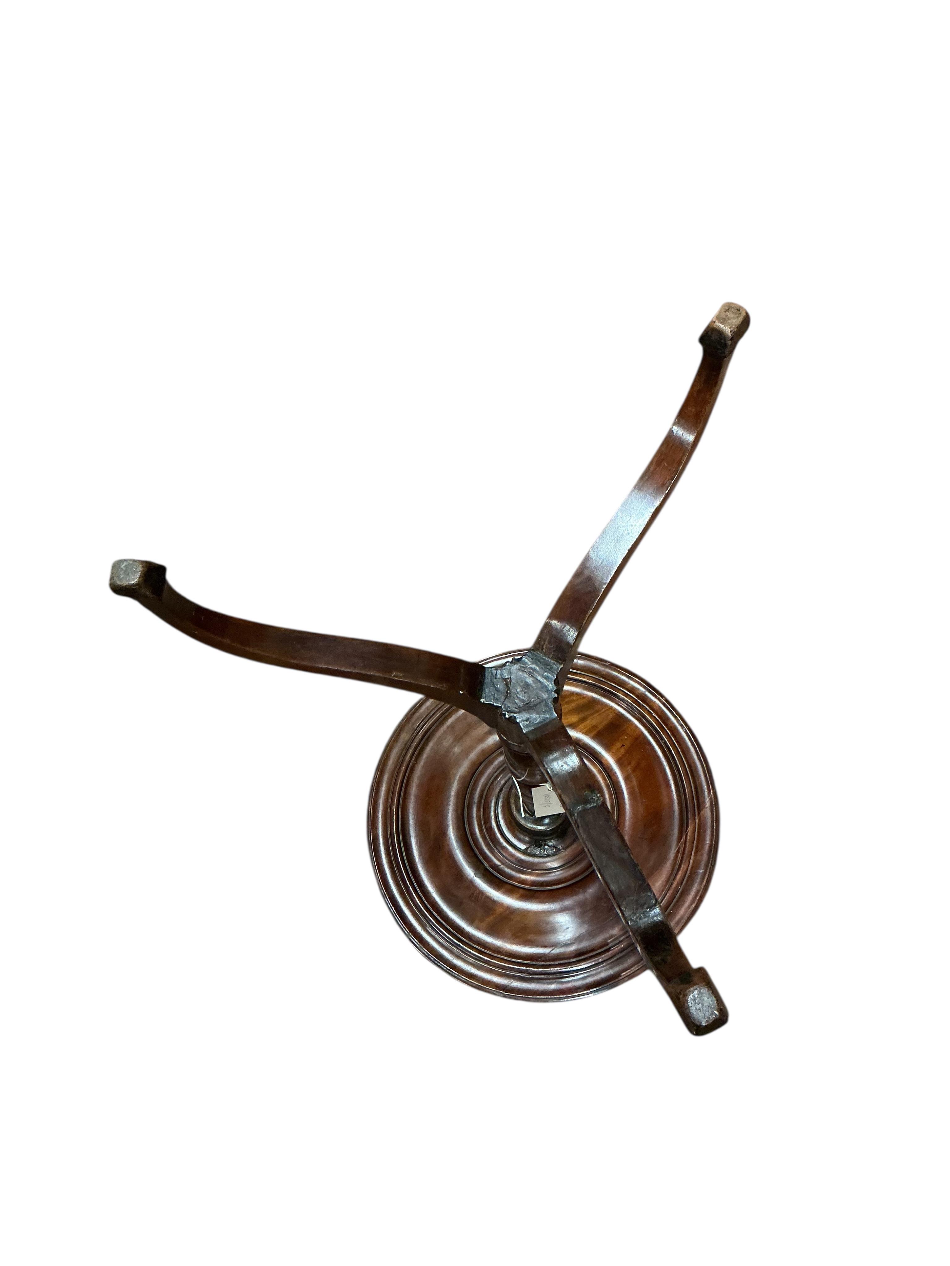 Two early 19th century circular mahogany tripod wine tables, larger diameter 50cm, height 69cm